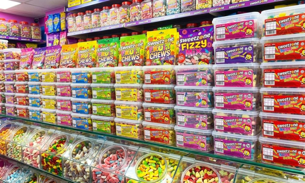  Range of Sweetzone branded halal sweets displayed in a sweet shop setting