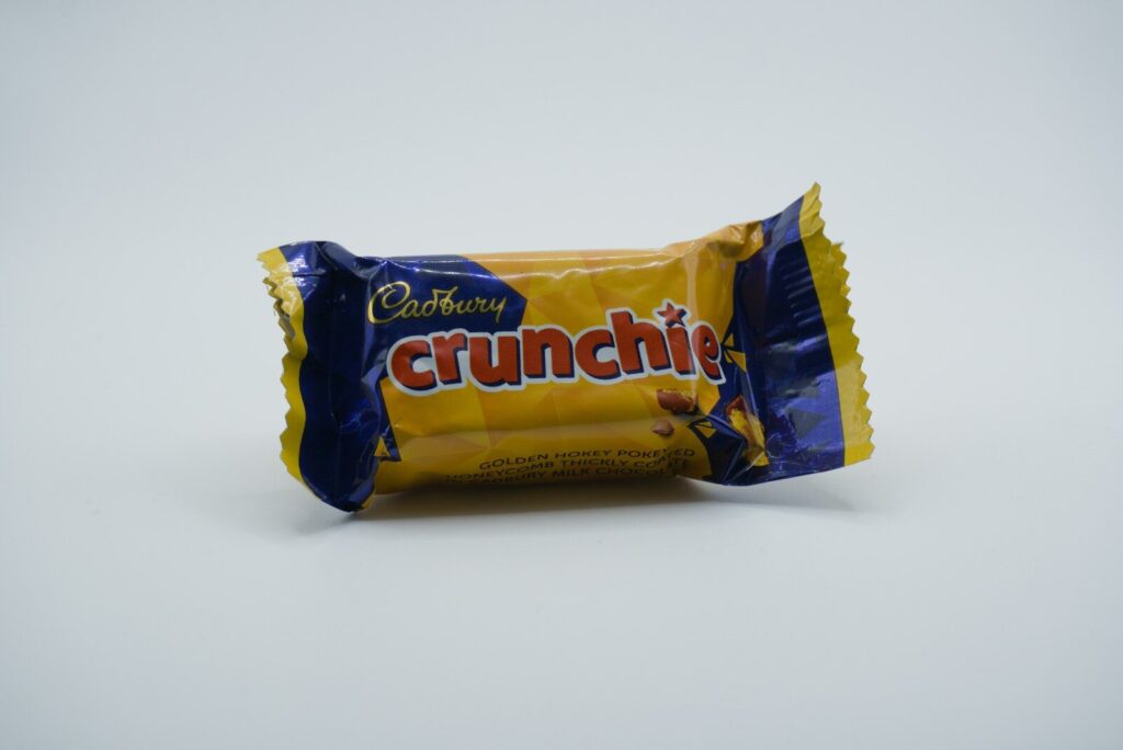Cadbury crunchie chocolate bar on white background